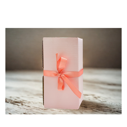 Pink gift box with a coral ribbon of Dutchmans square bloom candles, 8 in box