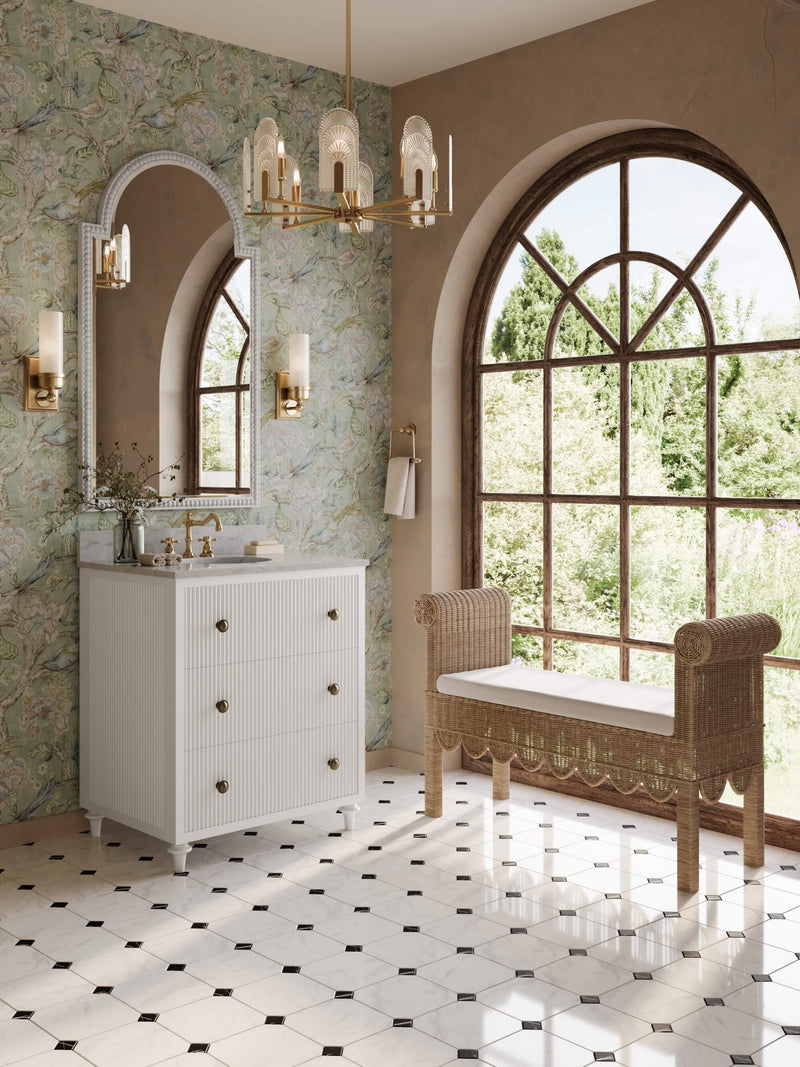 Bathroom with white vanity, floral wallpaper, and large window.